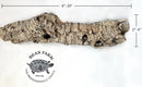 A piece of cork with measurements 6-20" in length, 2"-6" width.